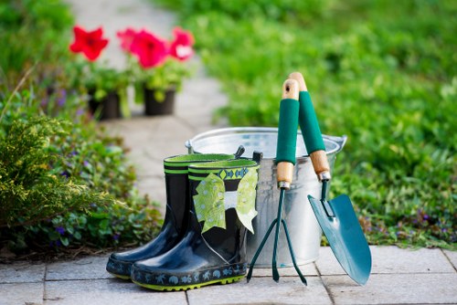 Team preparing tools for eco-friendly hedge trimming in Southgate